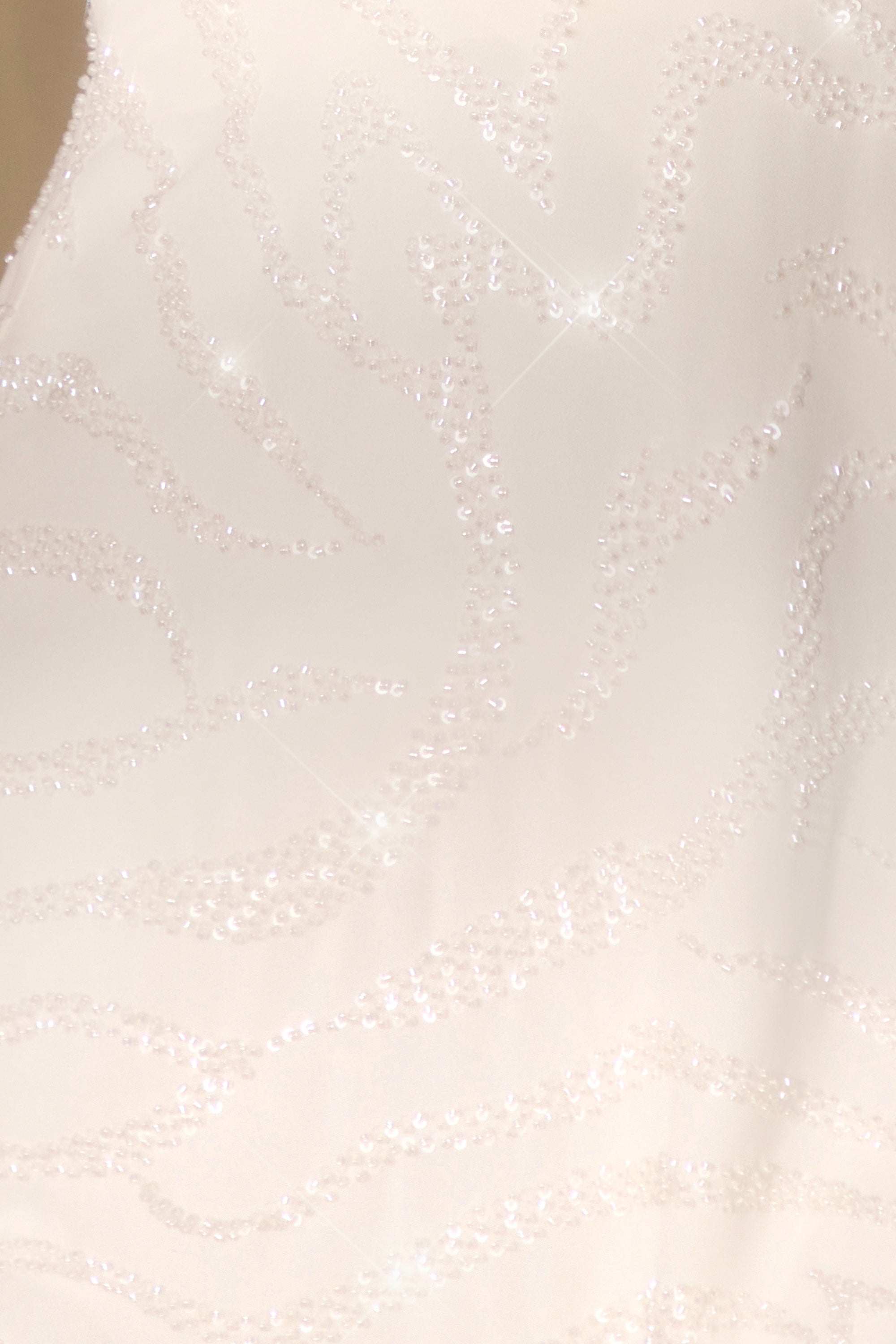 Saskia-Sleeveless Wrap Over Mini Dress in Off White